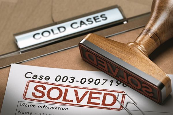3D illustration of a cold case file with a rubber stamp and the word solved. concept of successful police investigations